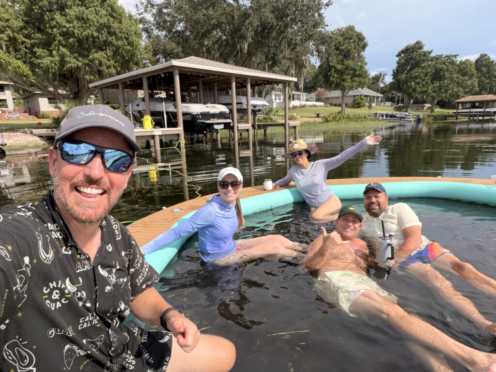 Joe Simonds with friends on the dock at Lake Eloise, all of whom live on the Winter Haven Chain of Lakes